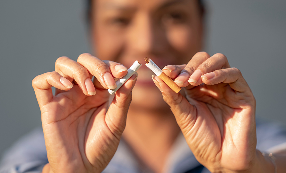 Woman breaking a cigarette