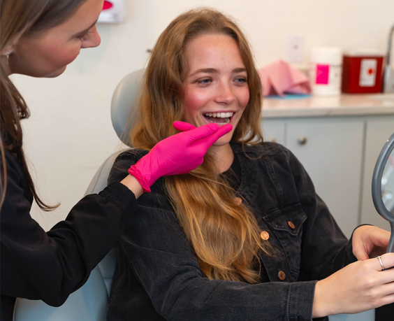 dental hygienist with patient