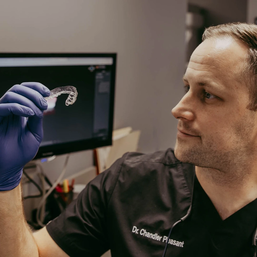 Dr. Pleasant with Invisalign aligner