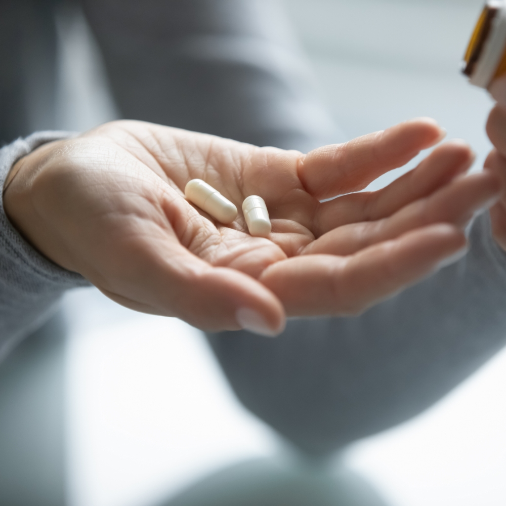 pills in patient's hand
