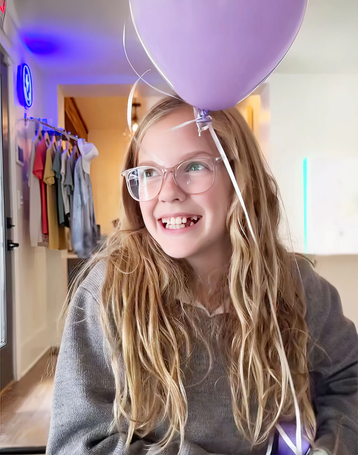 Child smiling with a balloon