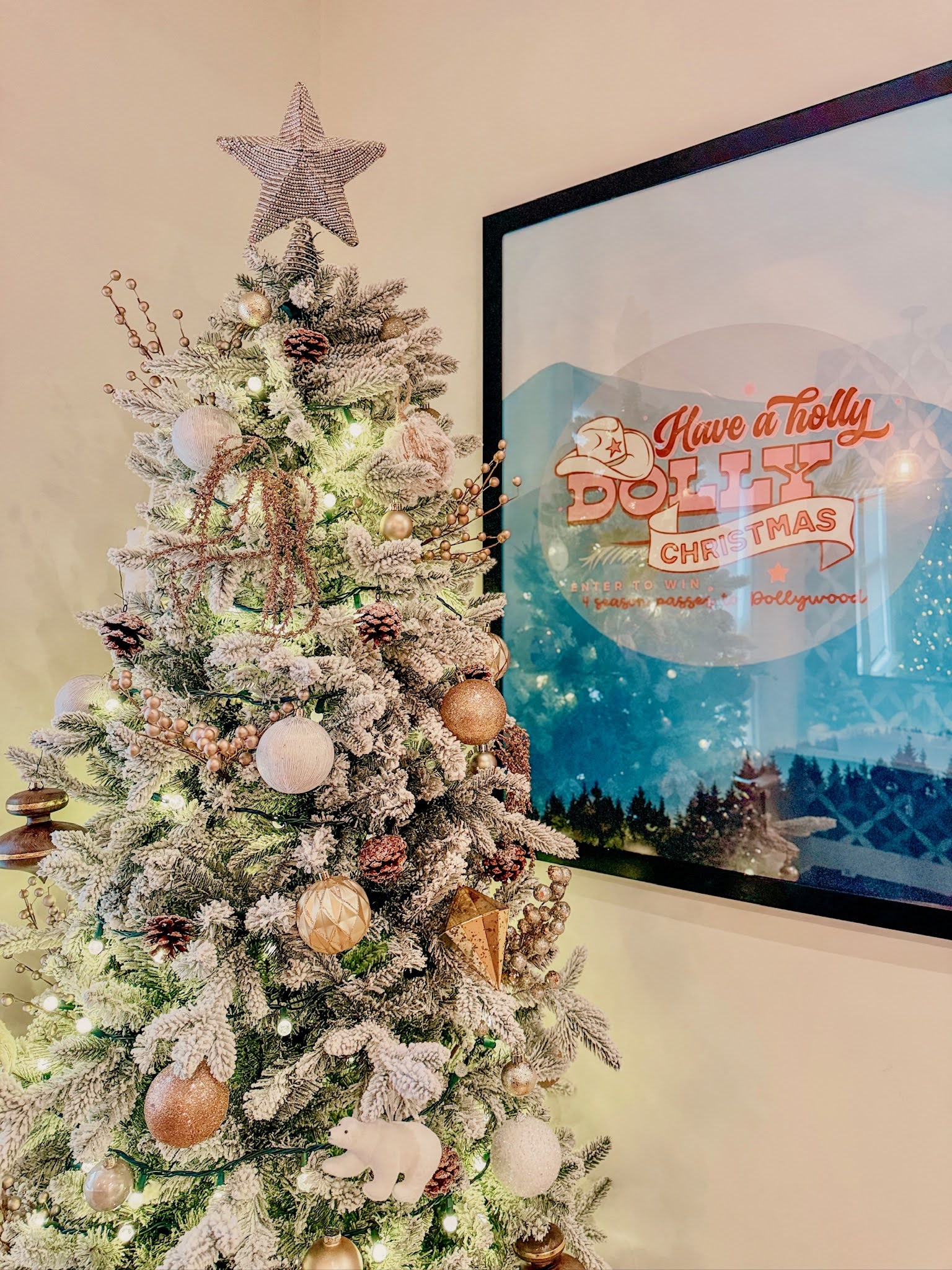 Holiday tree with "Holly Dolly Christmas" poster