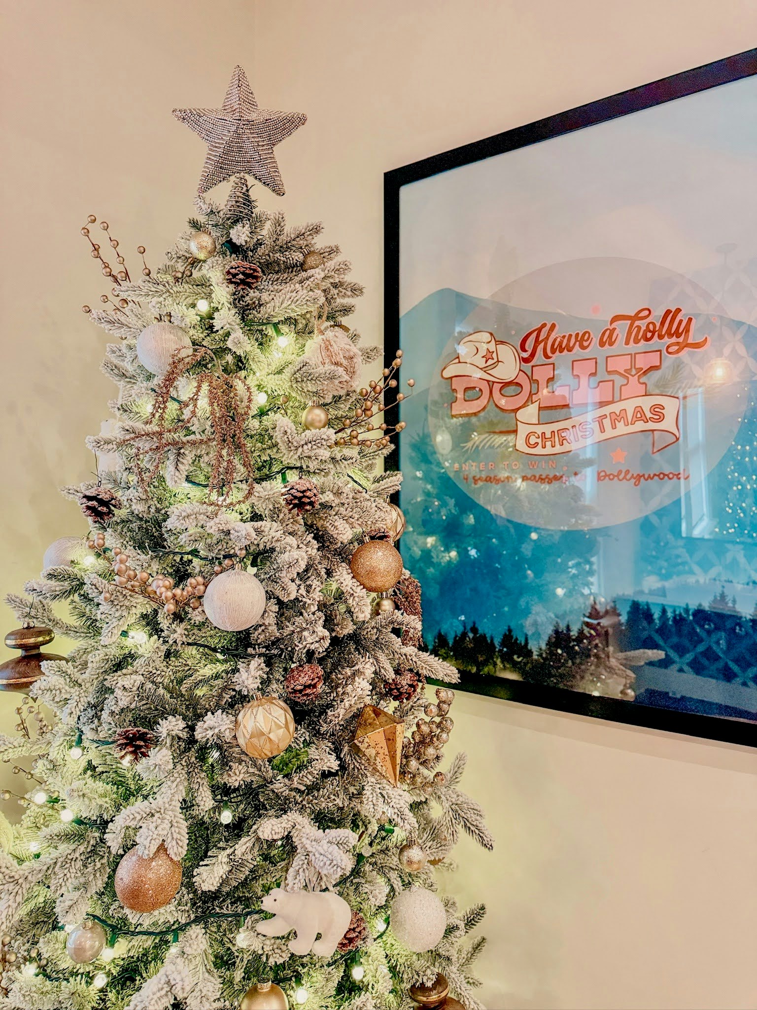 Holiday tree with "Holly Dolly Christmas" poster
