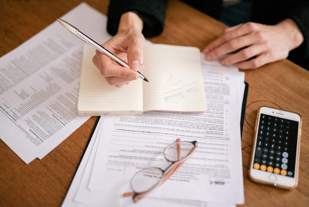 Person writing at desk