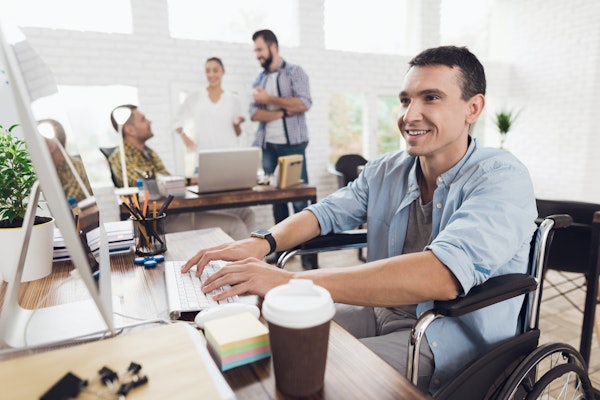 Man in wheelchair working