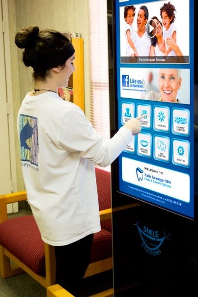 Girl using Smile Station