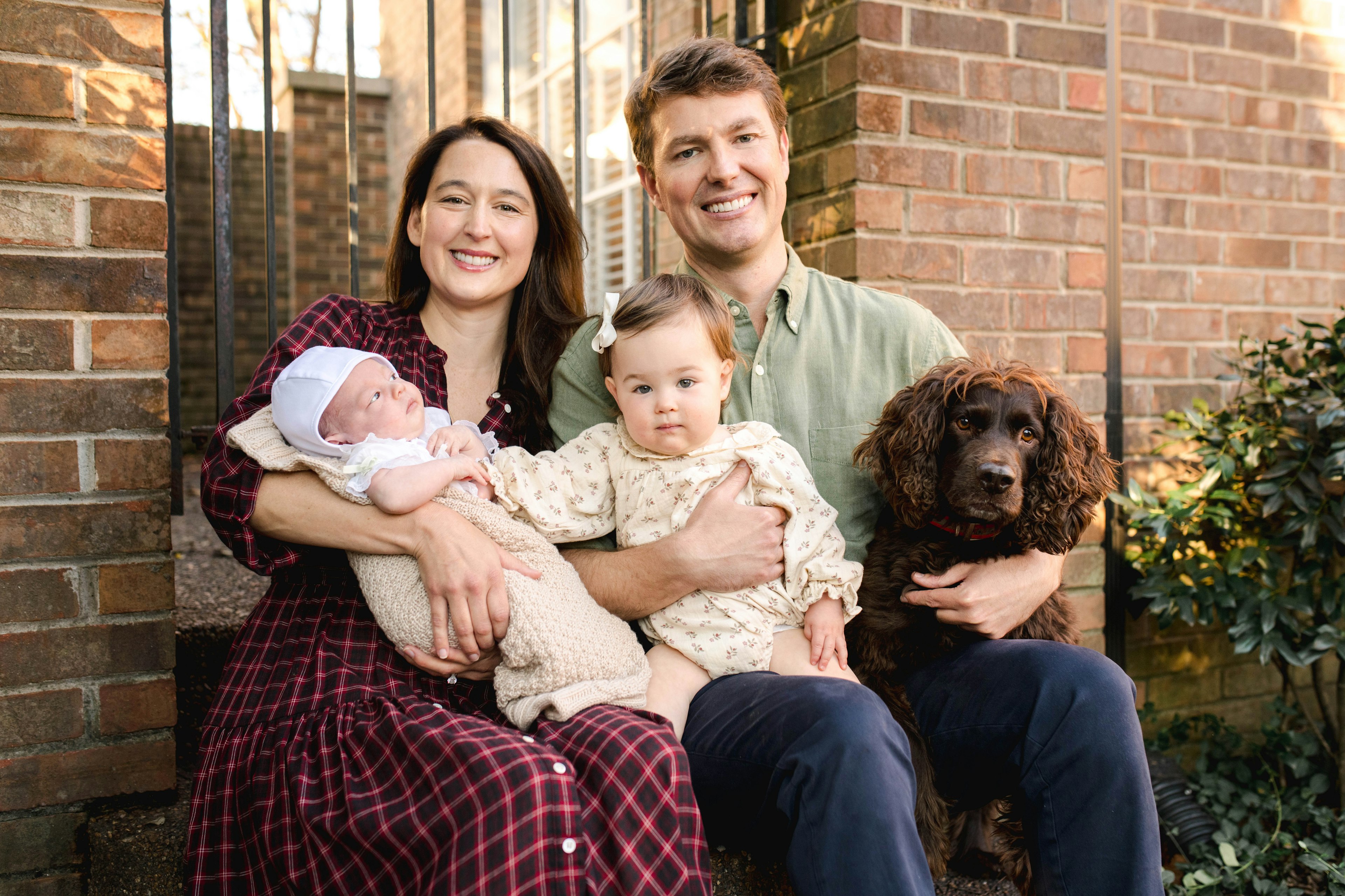 Dr. Bob Wilson with his wife, dog, and two young daughters