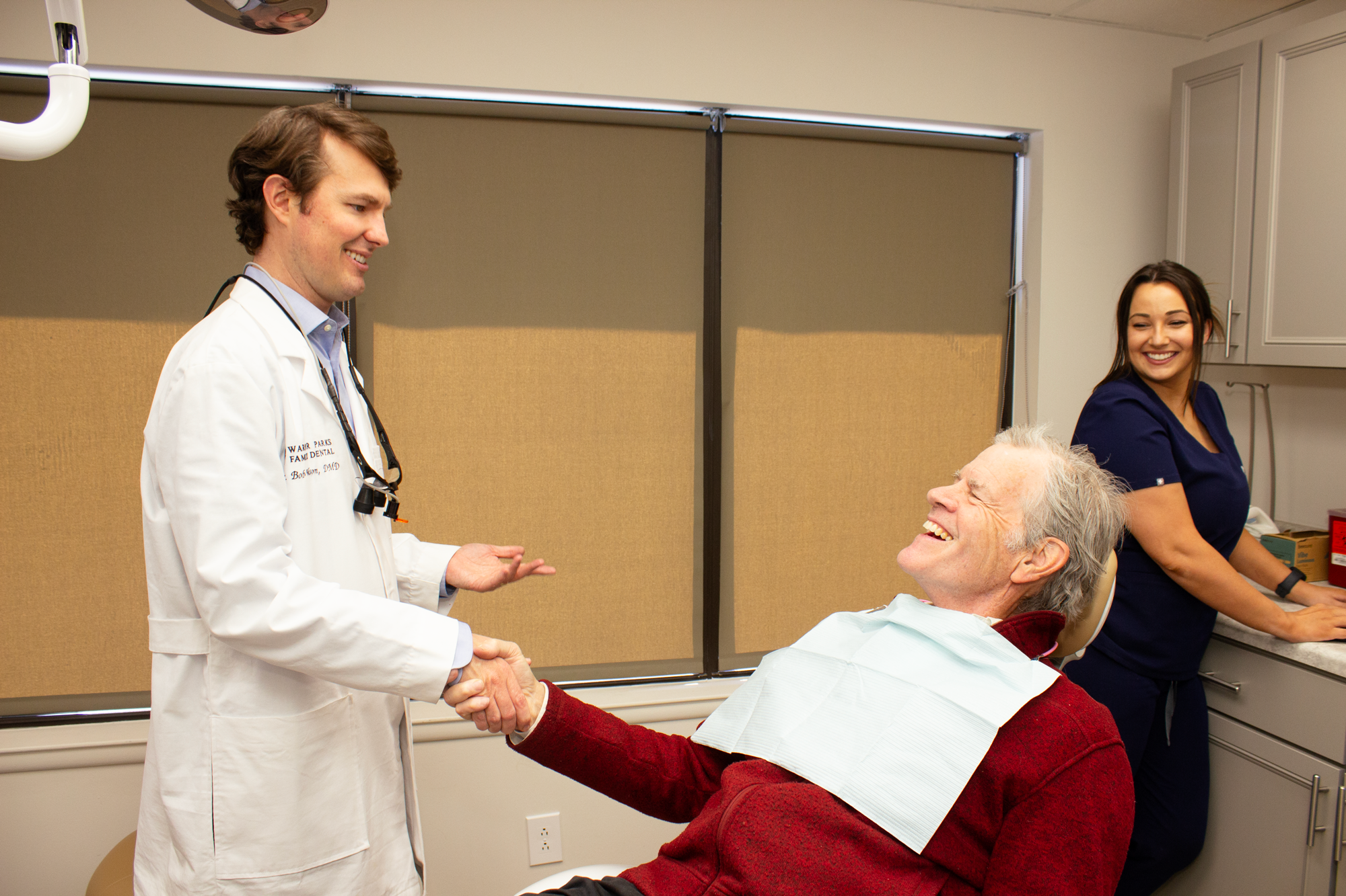 Dr. Bob Wilson shaking hands with a patient