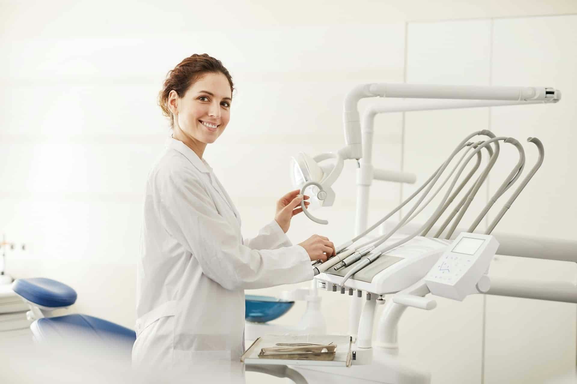 dentist in front of machinery