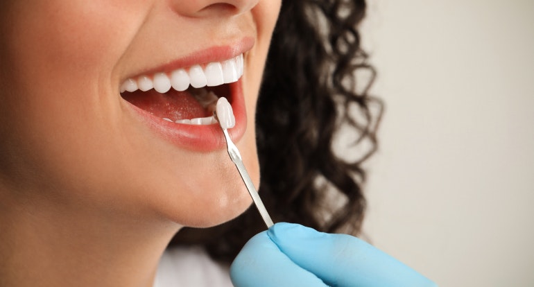 Woman receiving a veneer