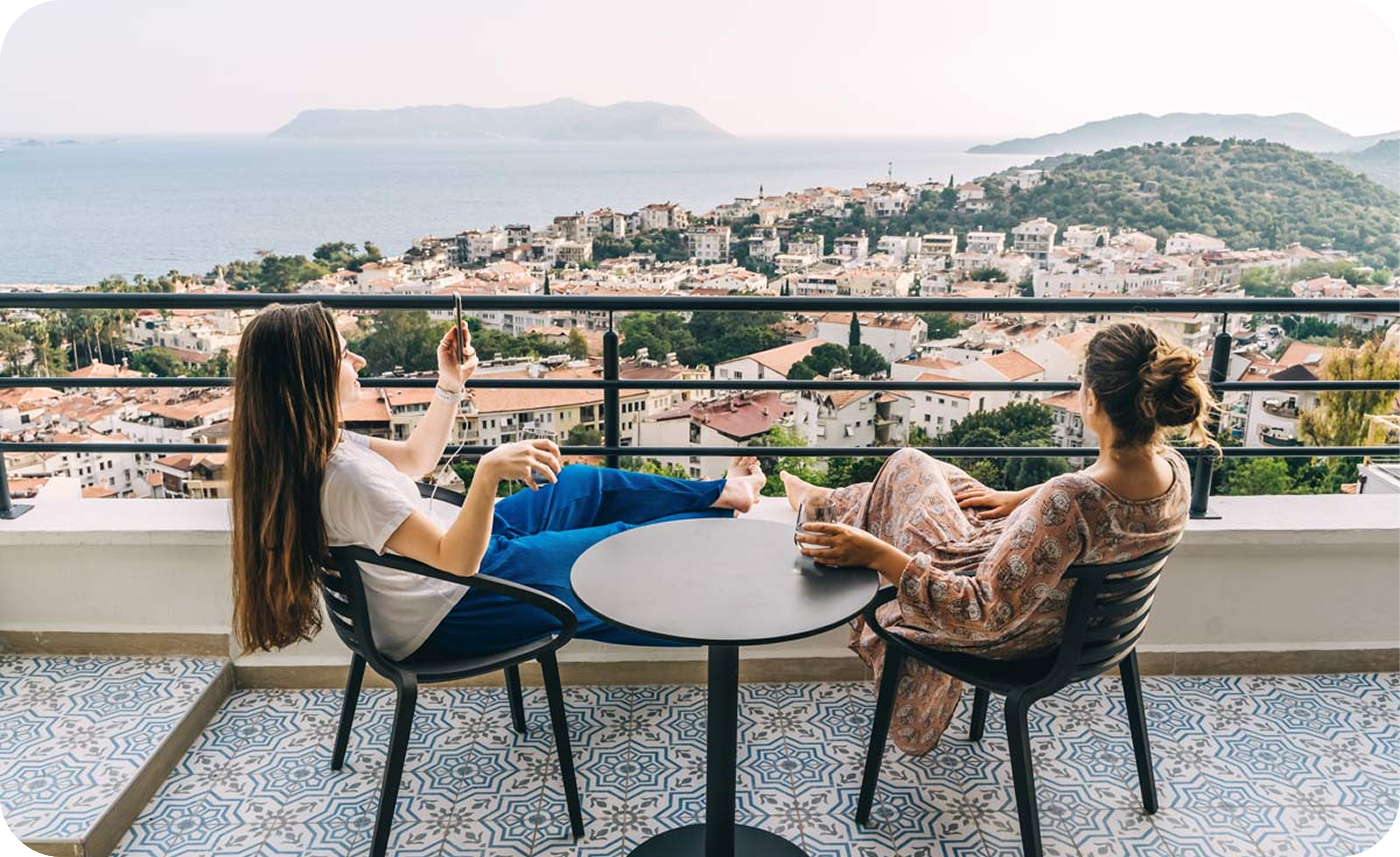 women sitting on balcony in Mexico