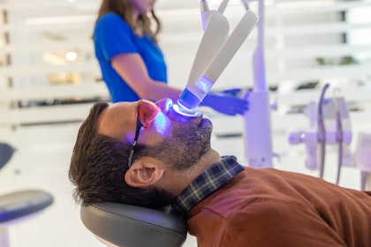 Man getting his teeth professionally whitened