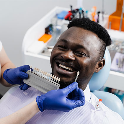 Man getting shade matched for veneers