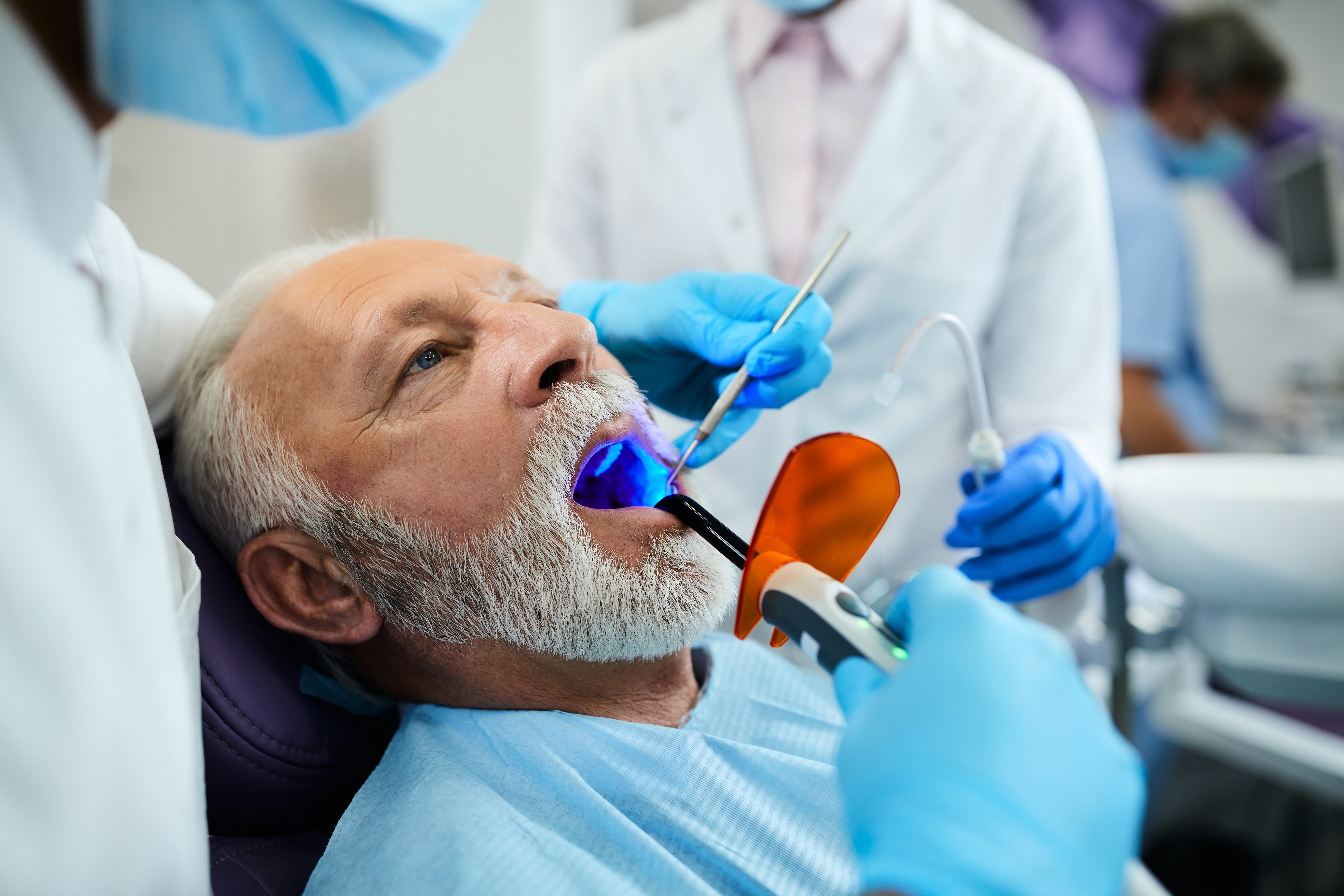 Mature man getting a dental filling