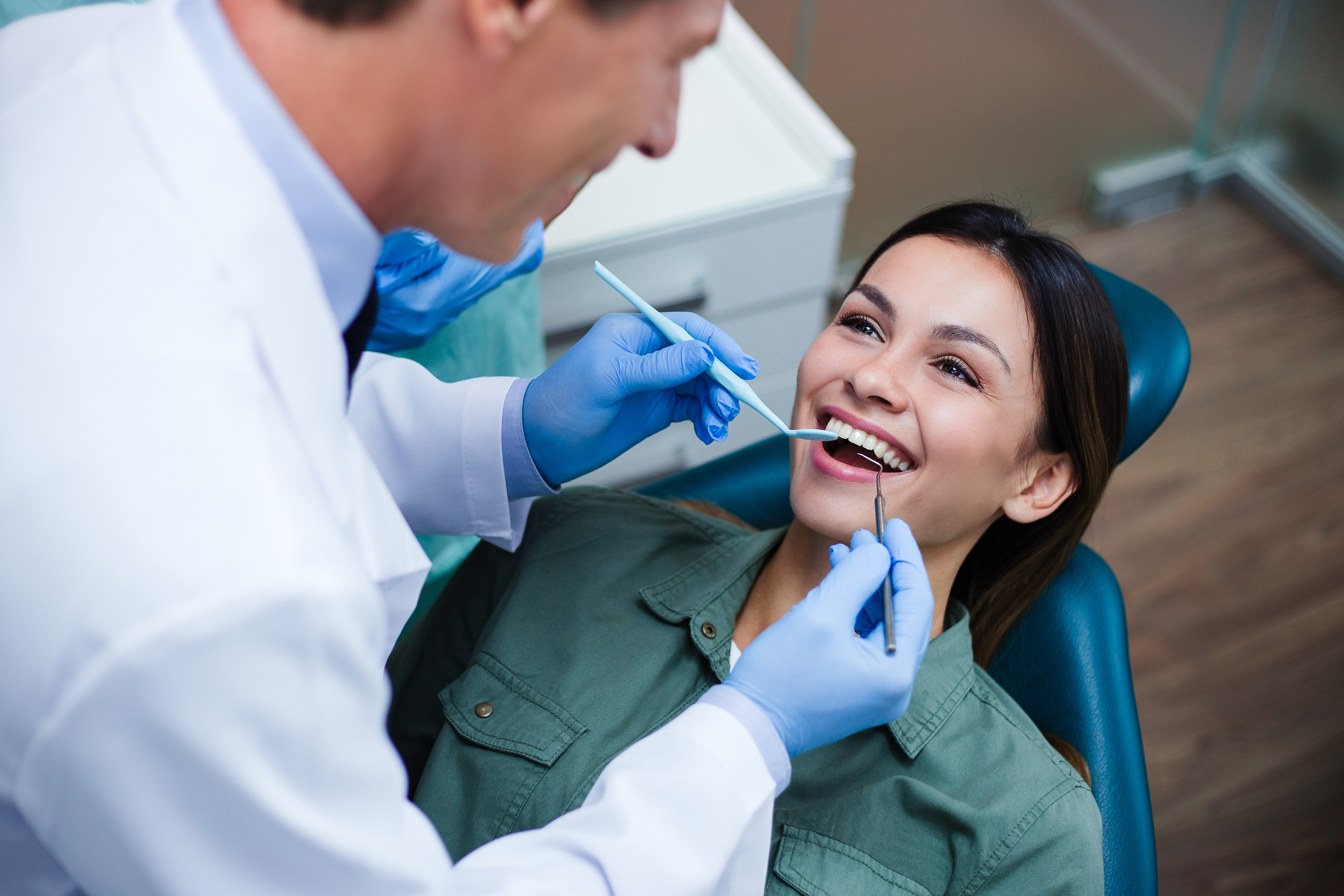 Woman getting a routine dental exam