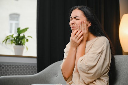 Woman in severe dental pain