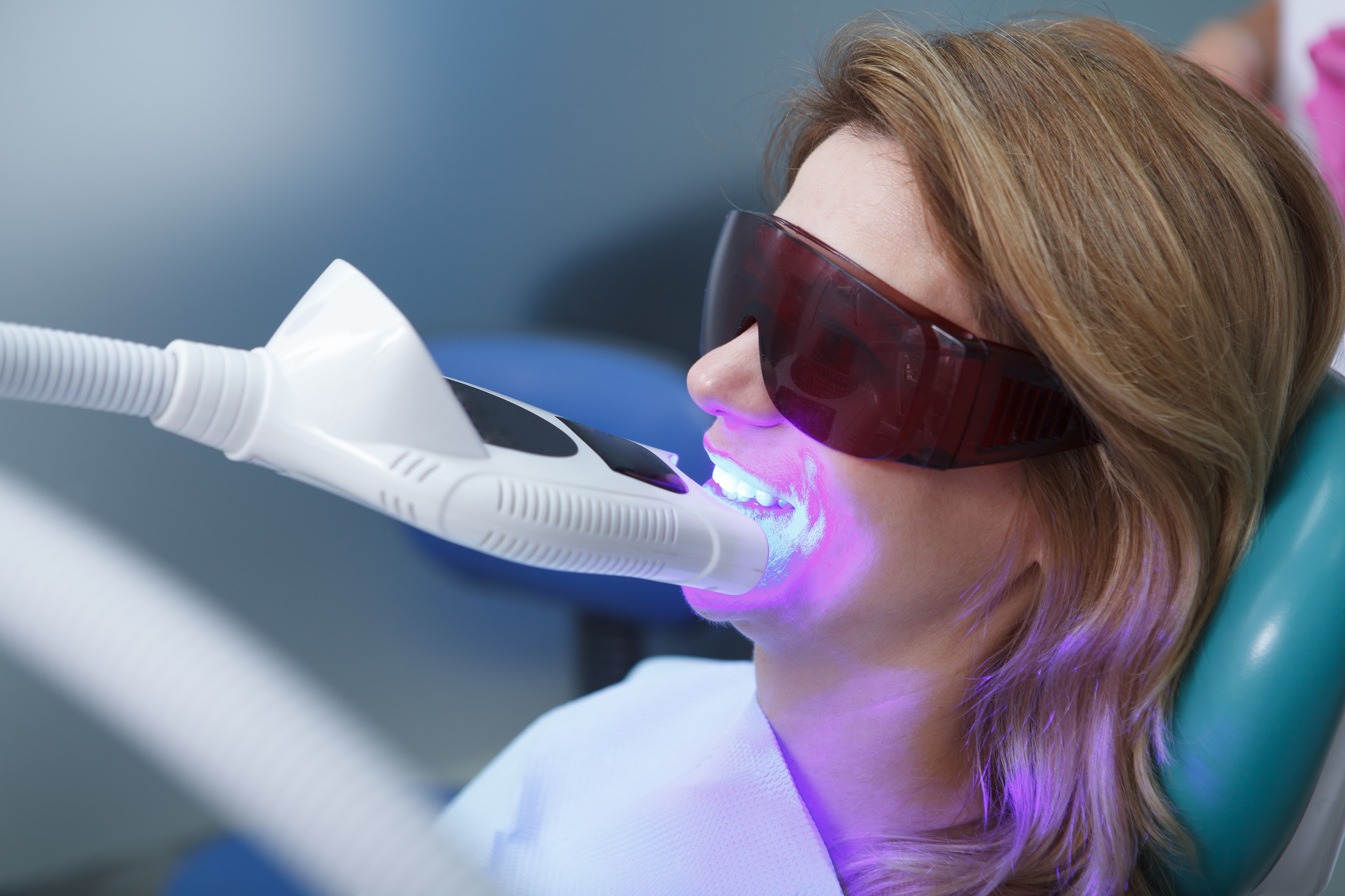 Woman getting her teeth professionally whitened