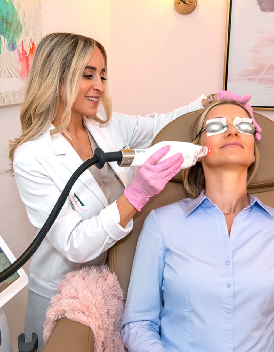 NP Nichole Gilbarty treating a patient