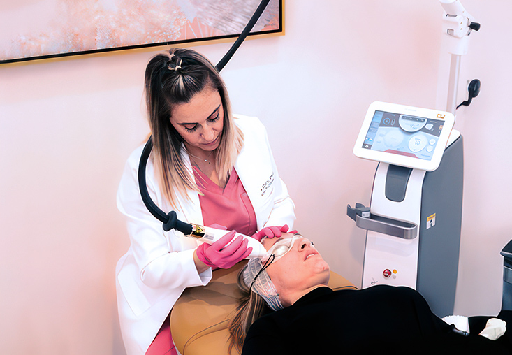 Nichole with a laser resurfacing patient