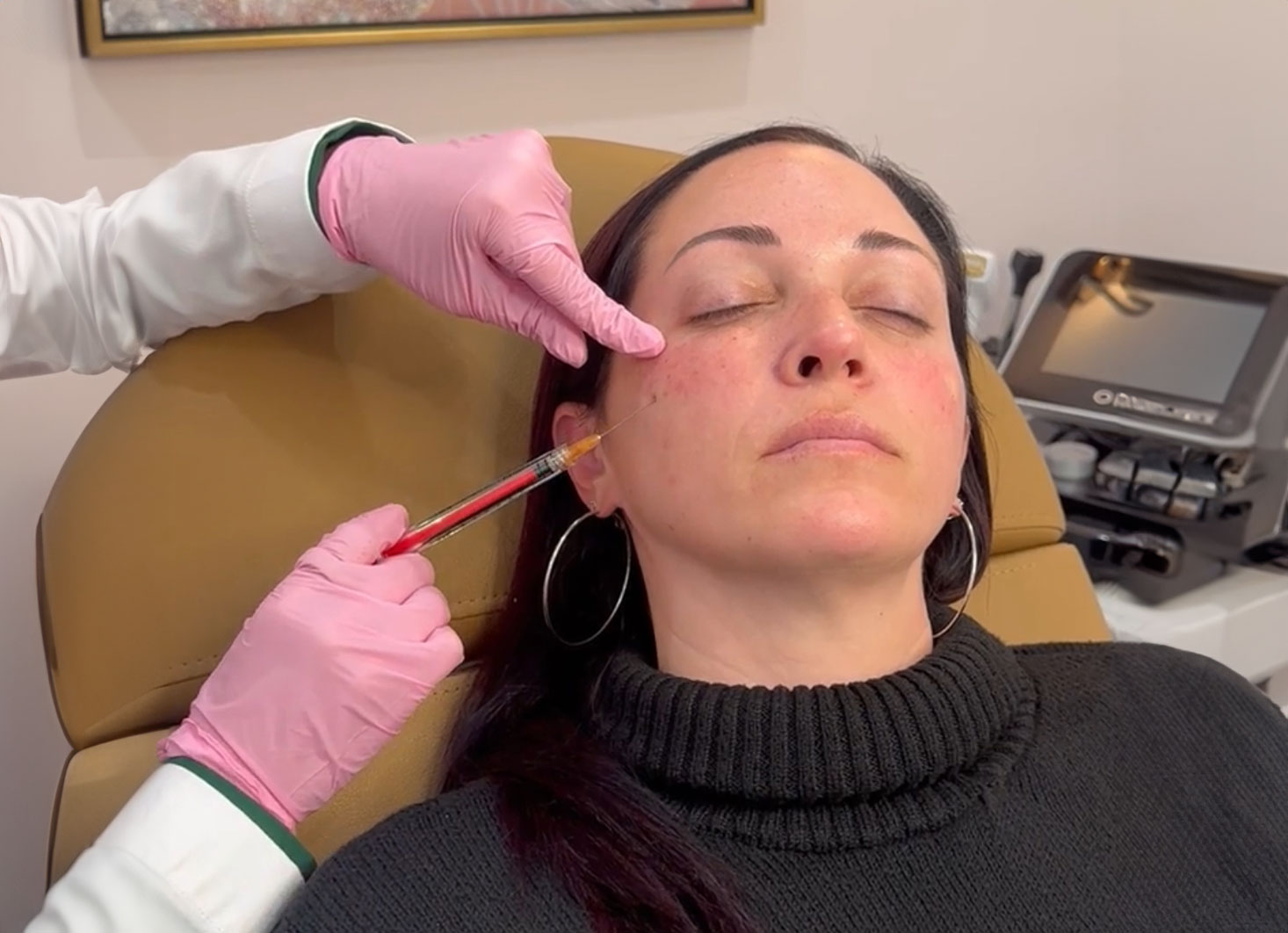 Nichole Gilbarty administering injectable treatment
