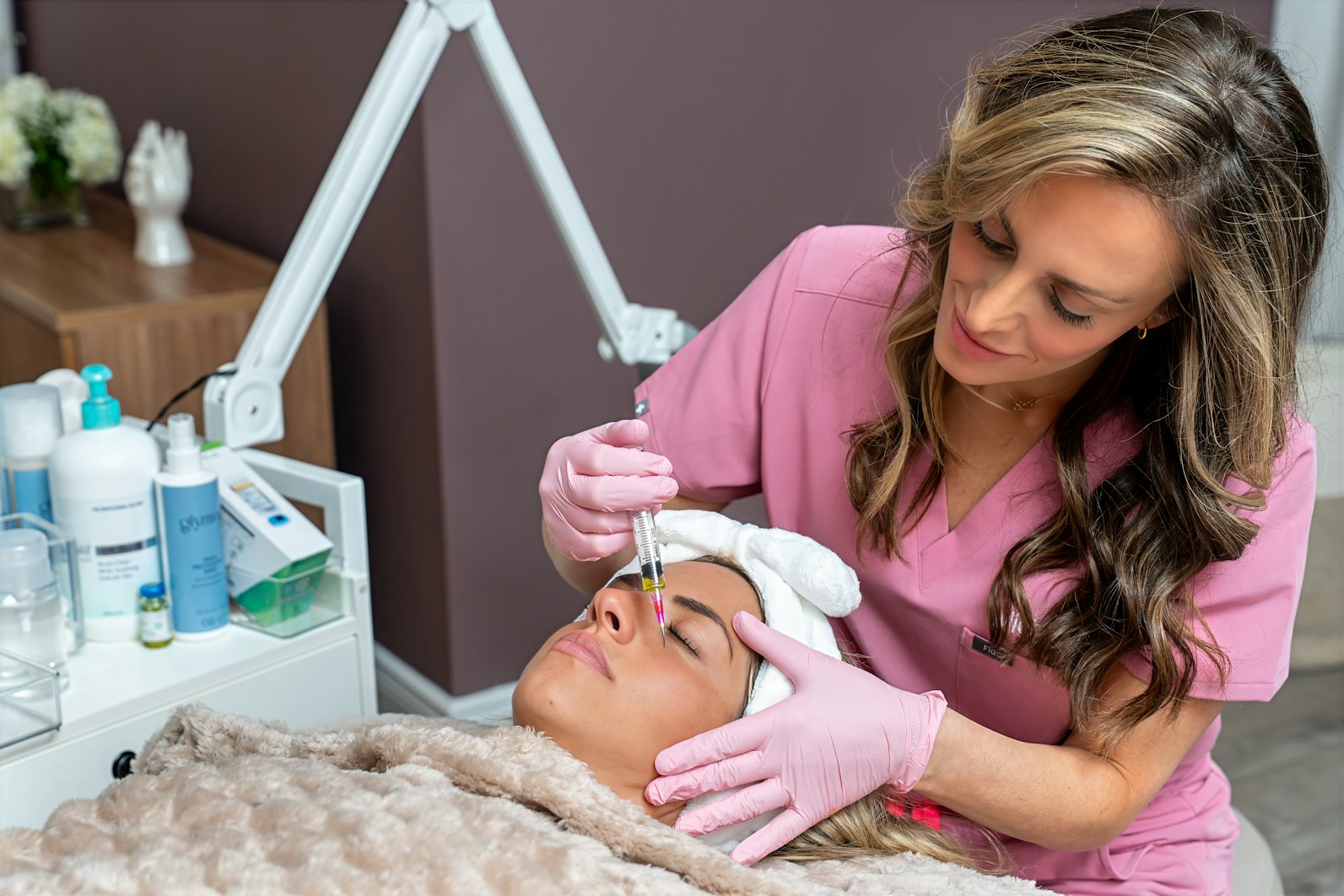 Woman getting under eye injections