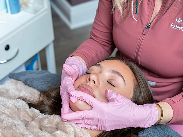our esthetician preparing a patient for treatment
