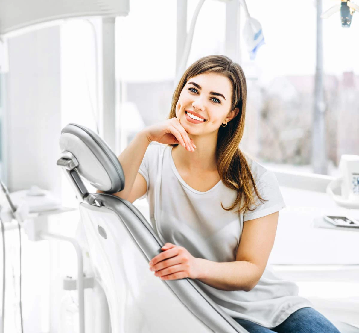 woman sitting in dental chair smiling