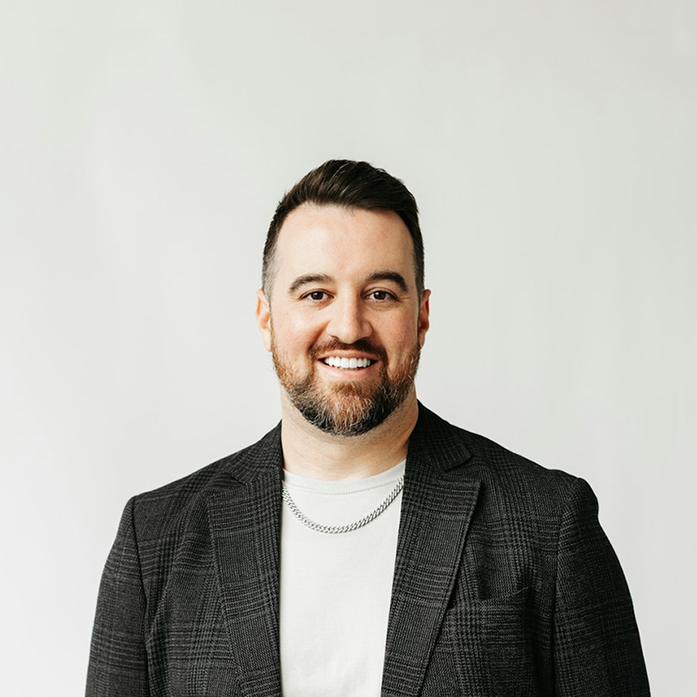 smiling man in suit jacket
