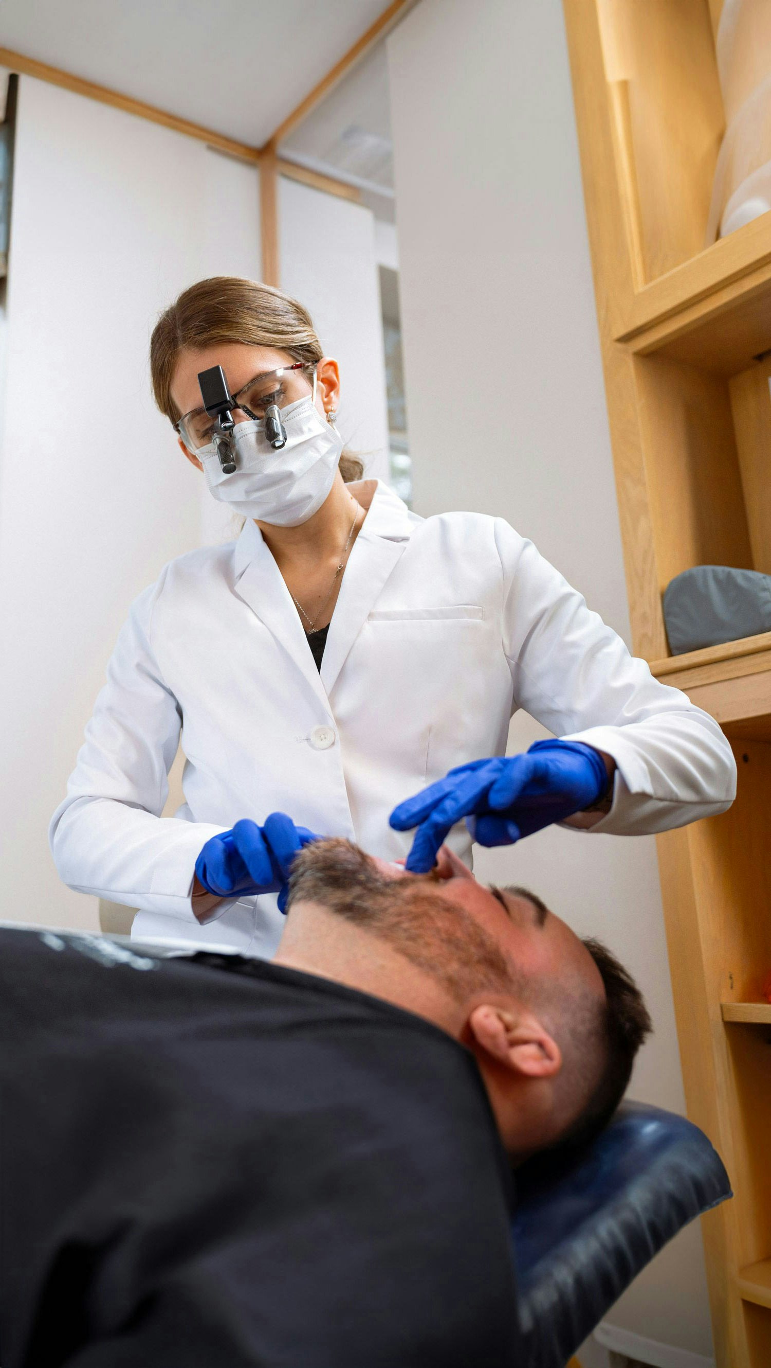 Dr. Lippe working on a patient