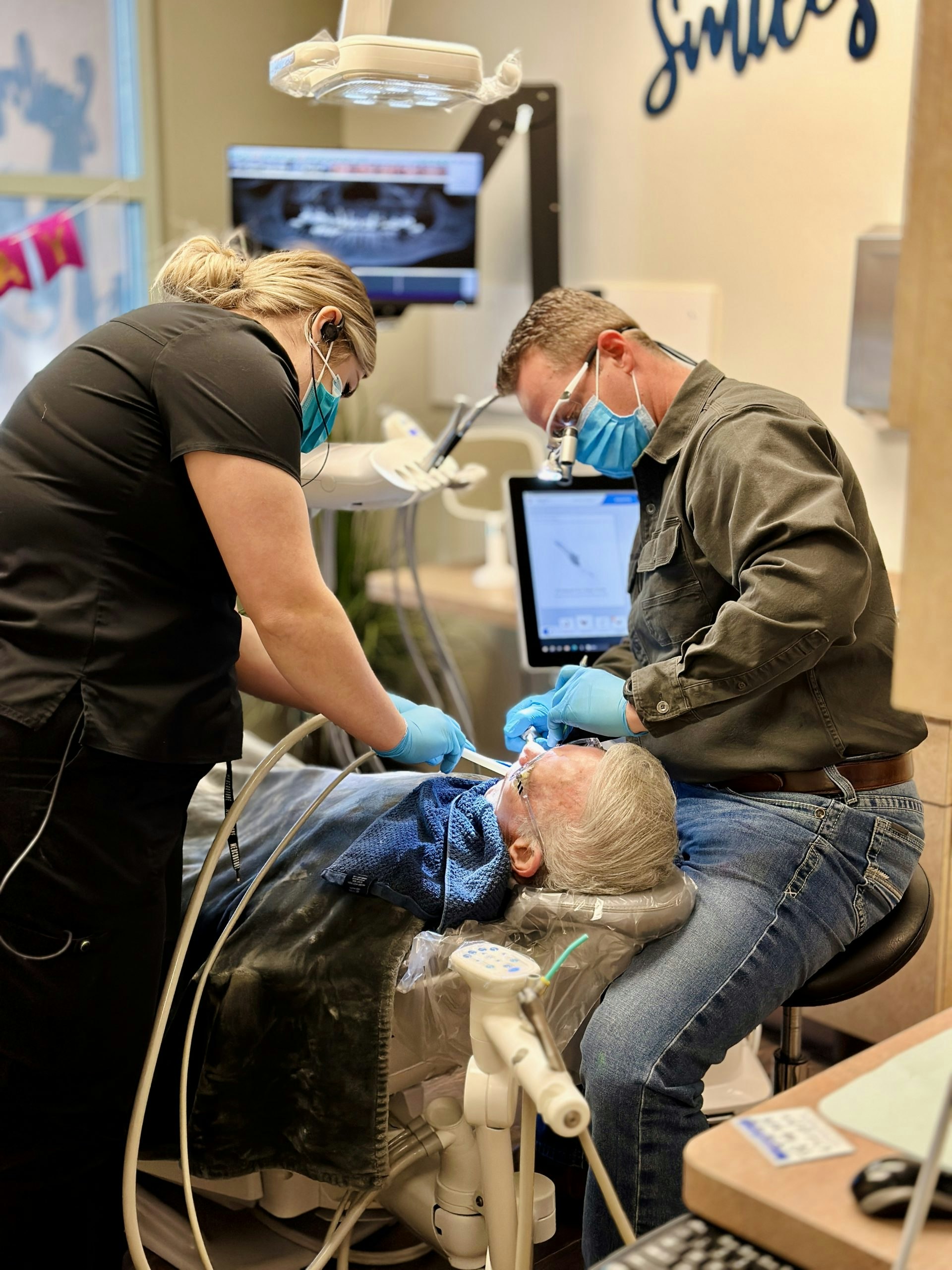 The Village Dental Center team consulting a patient