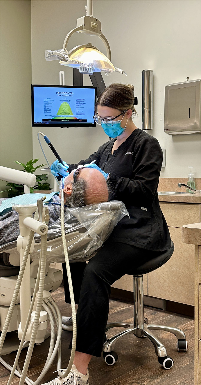The Village Dental Center patient getting teeth cleaned