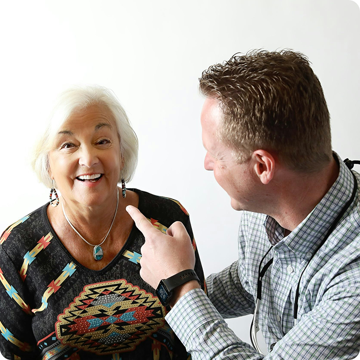 our dentist pointing to a patient