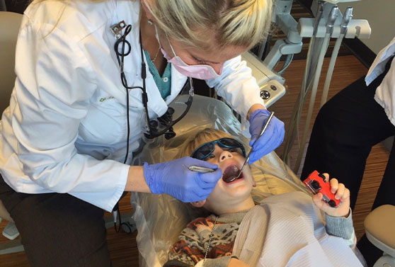 Dr. Wilson with a child patient