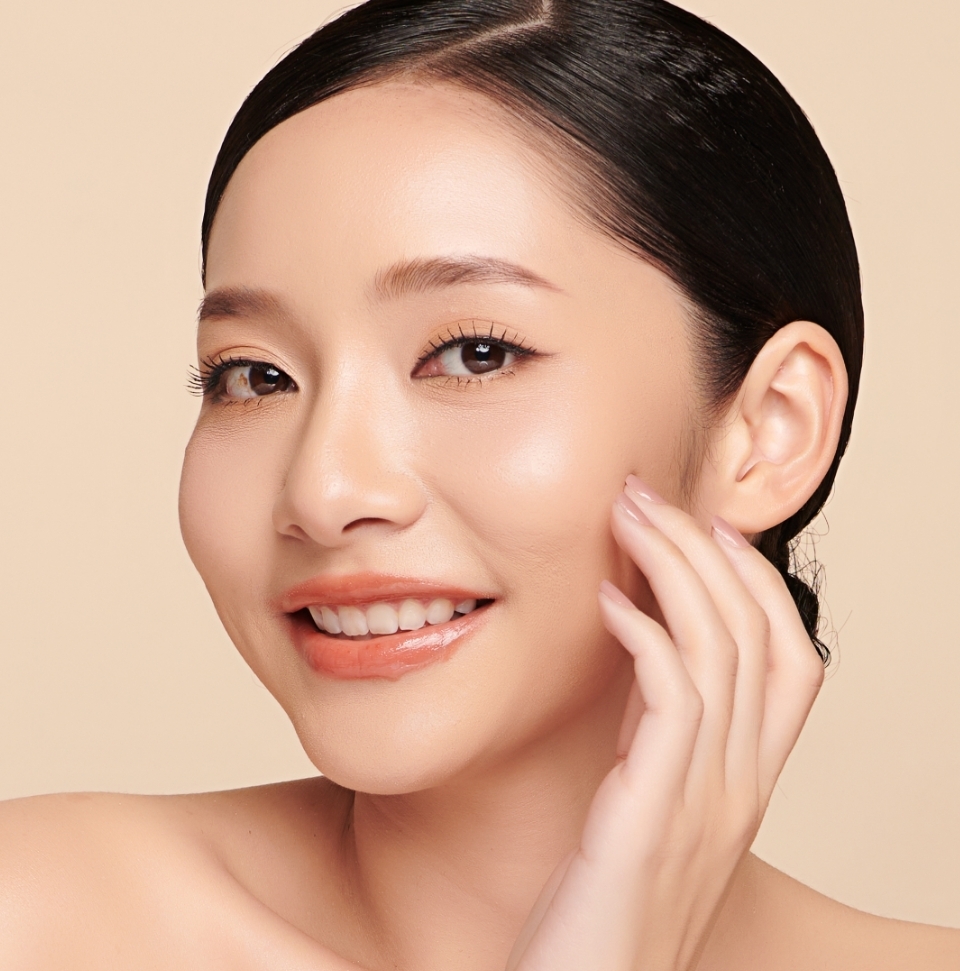 young woman admiring her skin