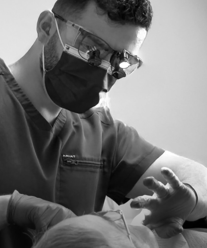 Dr. Faraj working on a patient
