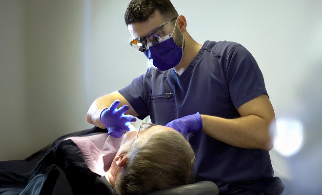 Doctor working on patient
