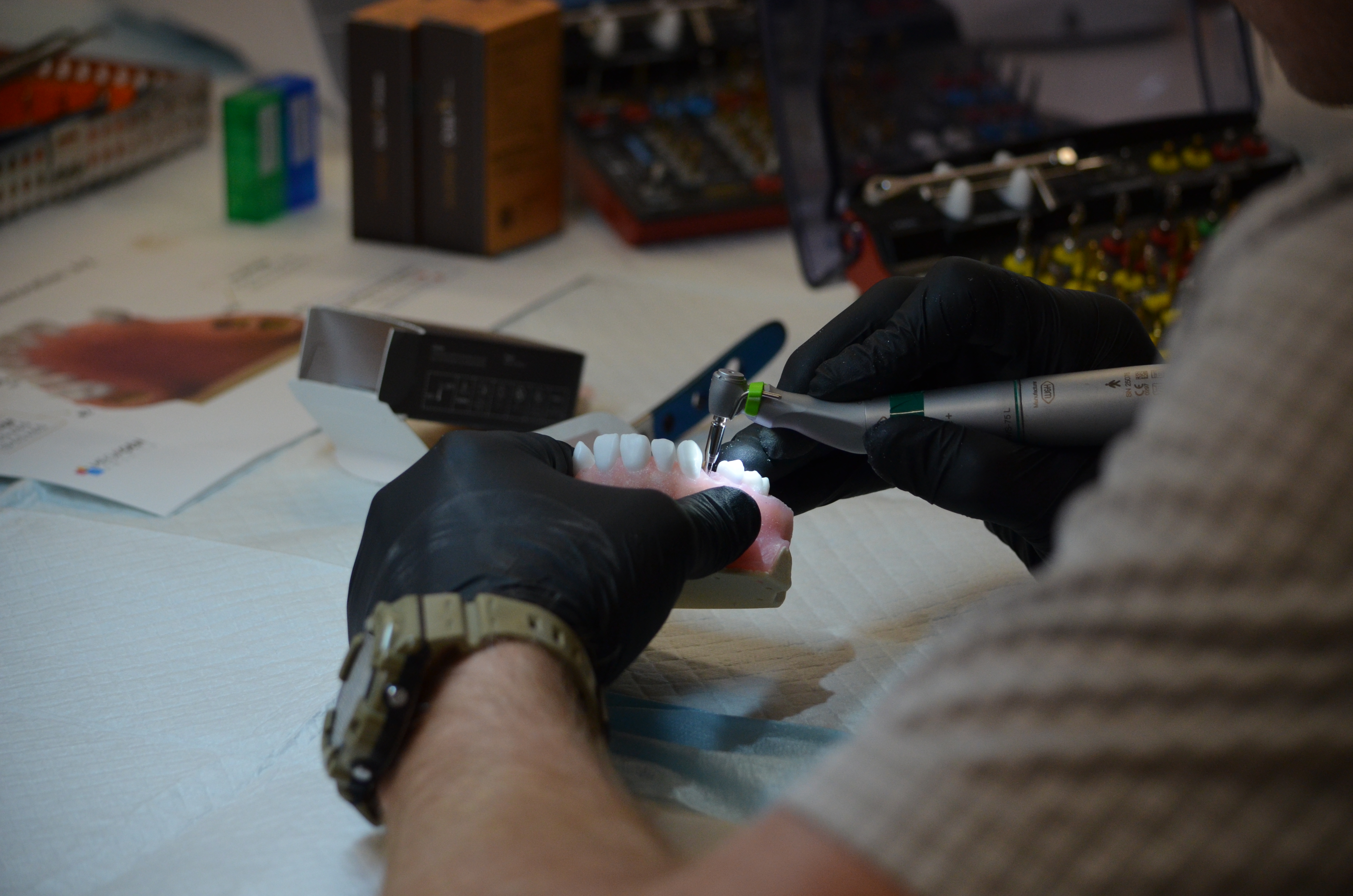 Close-up of hands crafting a dental prosthesis