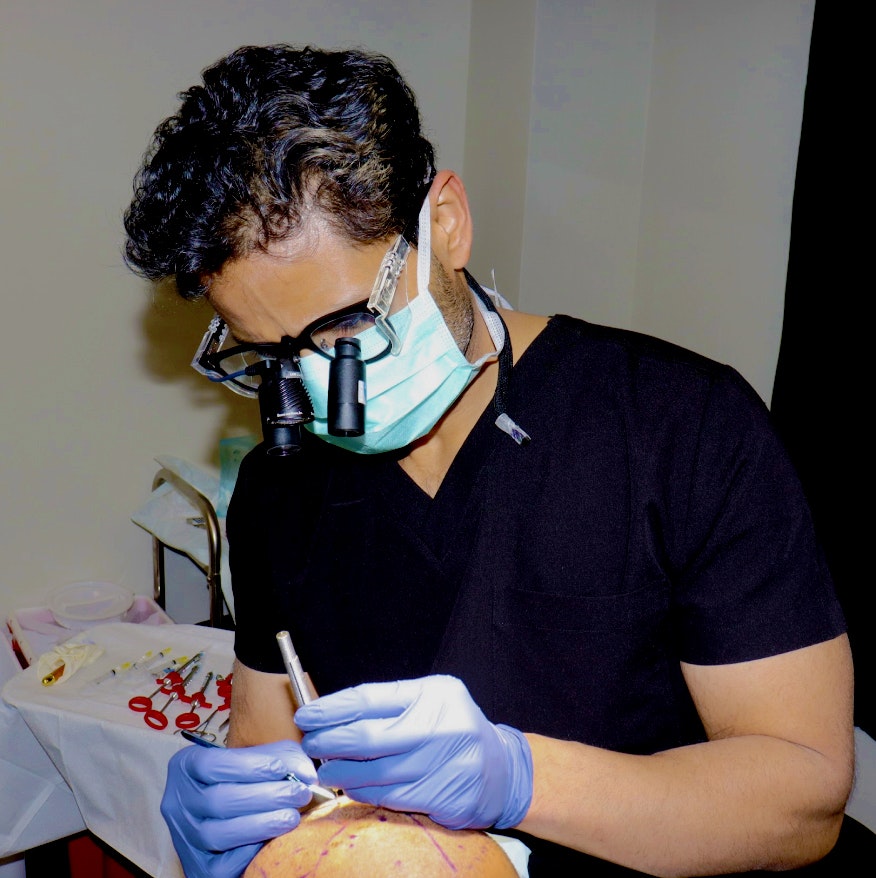 Dr. Shah working on a patient