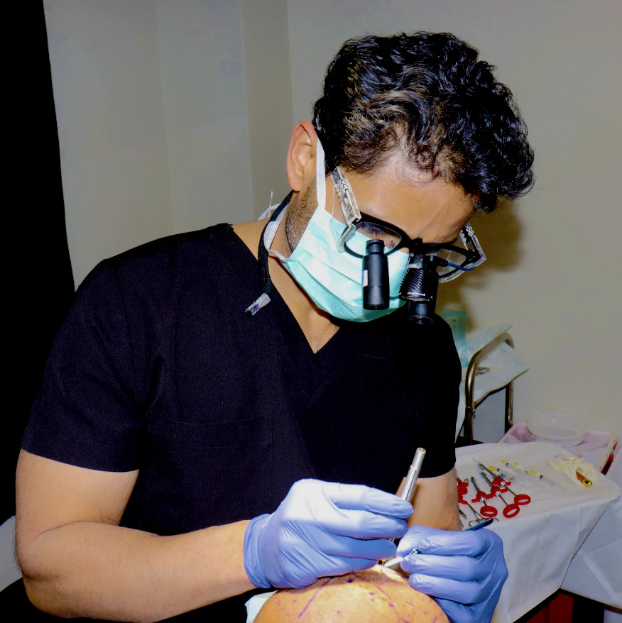 Dr. Bhumik Shah operating on a patient