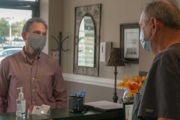 Dr. Siegel welcoming a new patient