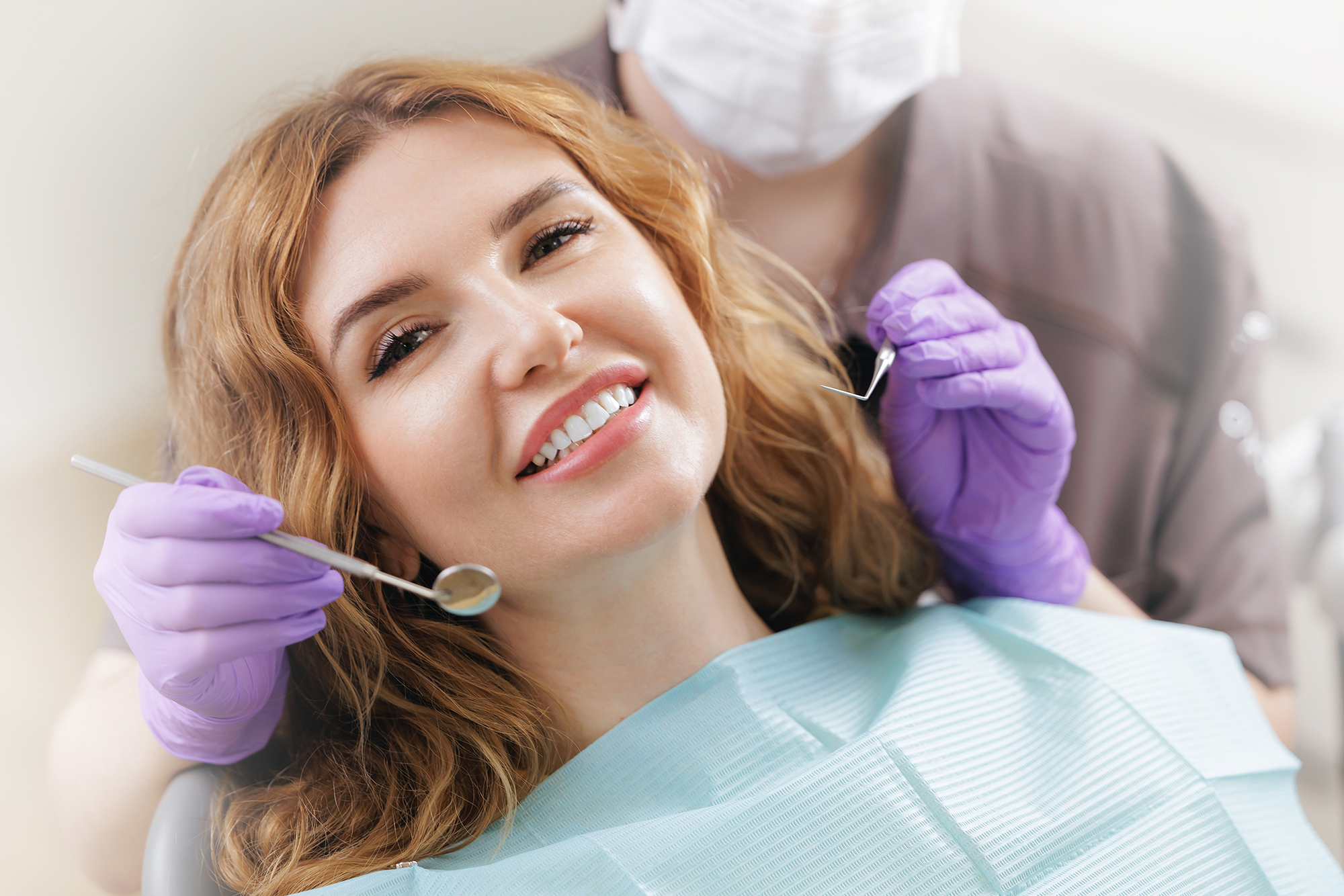 woman smiling in the dental chair