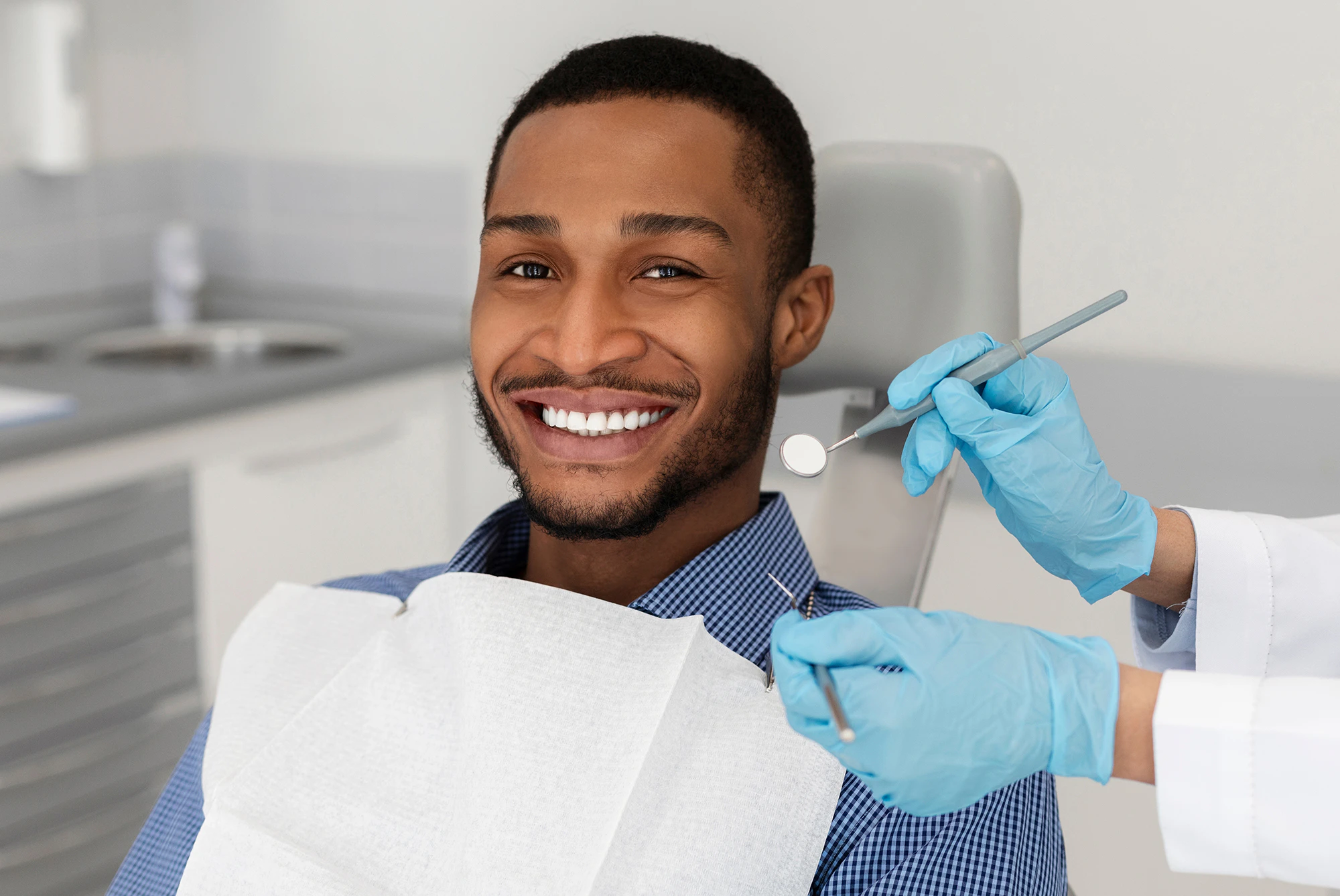 man smiling in the dental chair