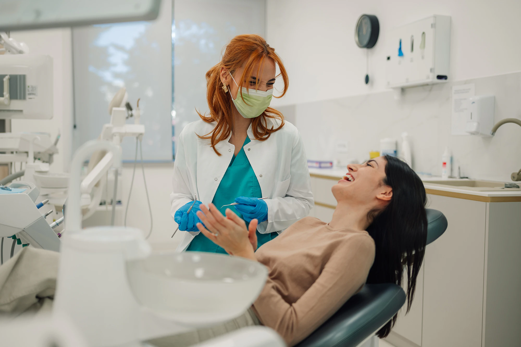 dentist speaking with woman in the dental chair