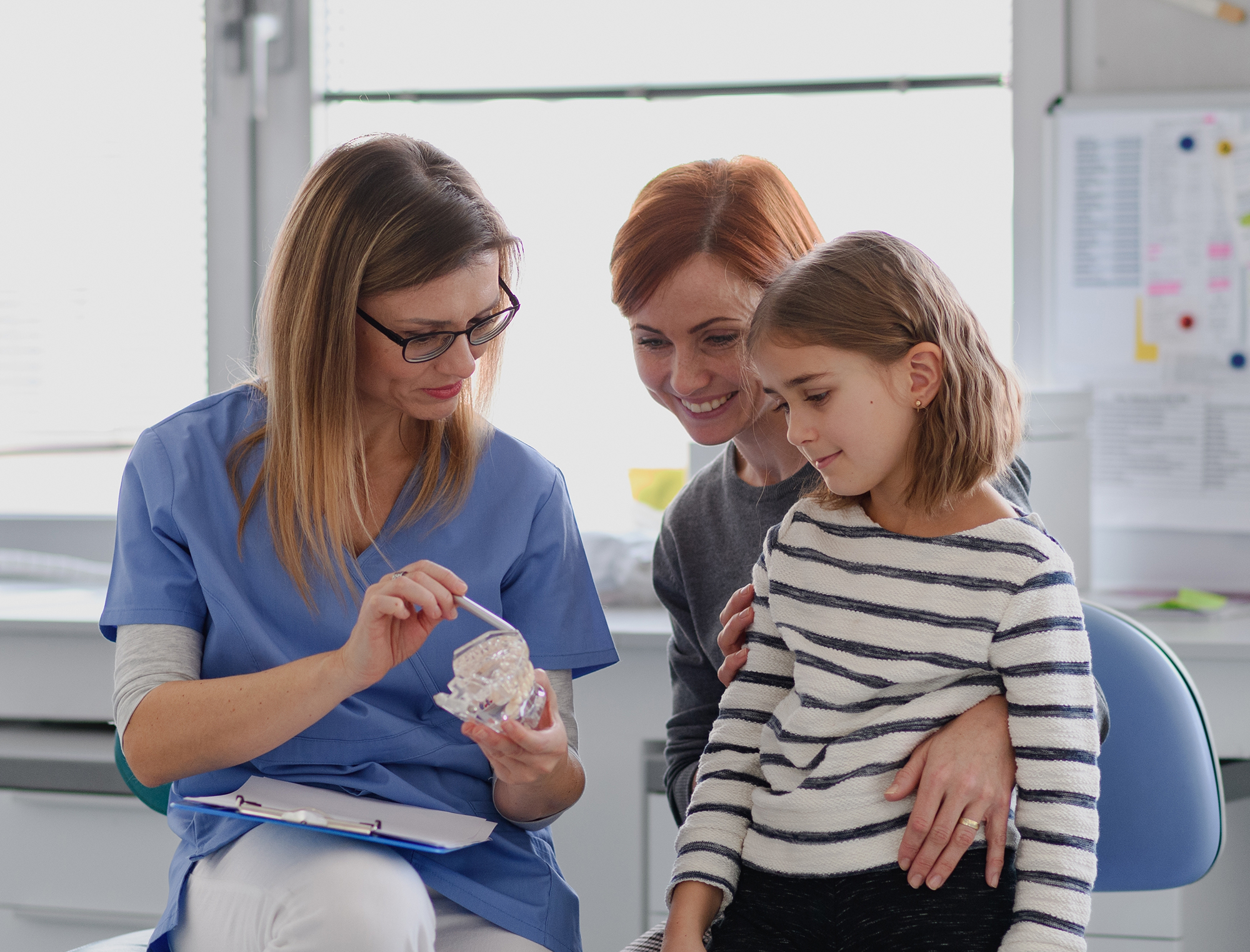 mother and daughter visiting the dentist