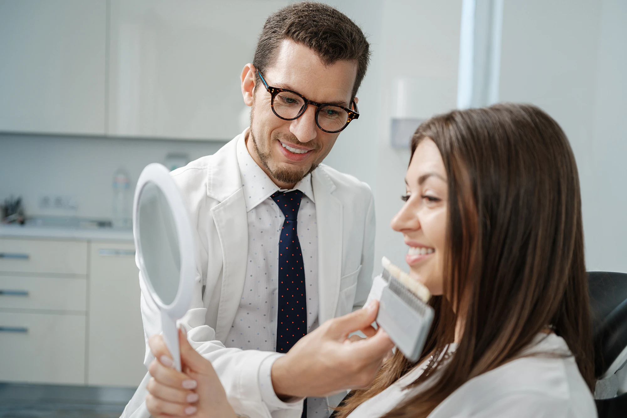woman exploring veneers with her dentist