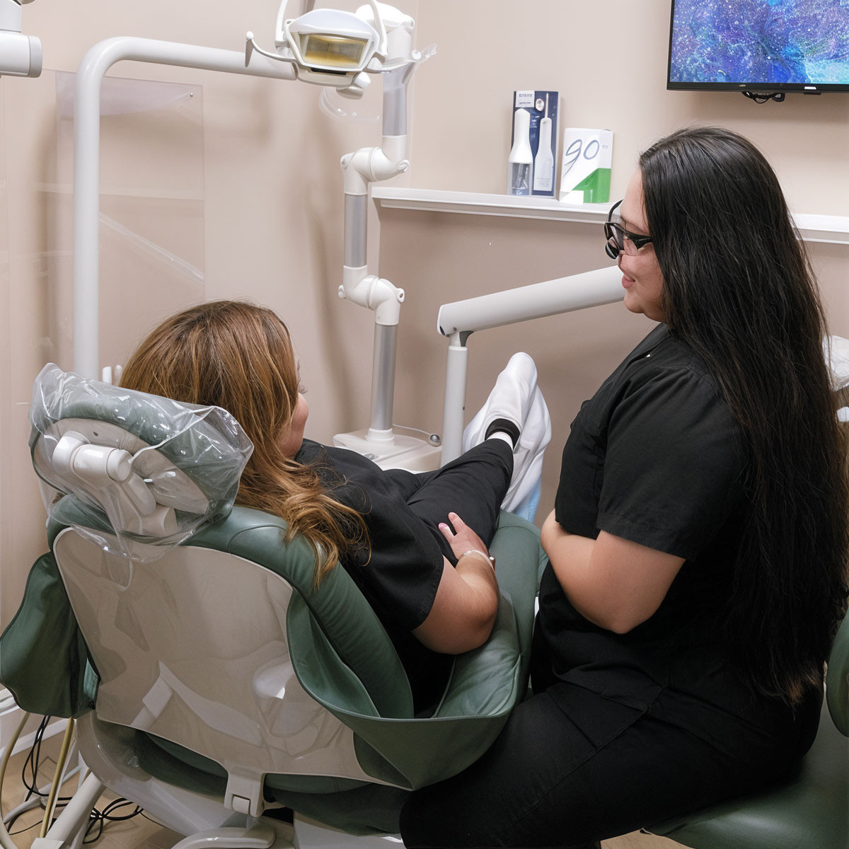 Dentist speaking with patient