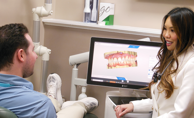 dentist speaking with woman