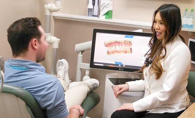 Dr. Manlucu speaking with patient