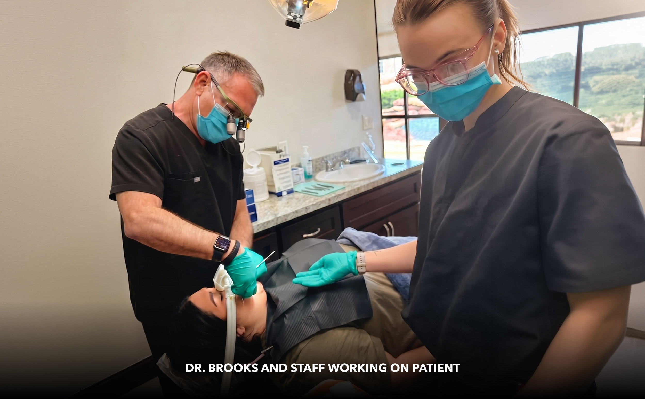 Dr. Brooks and staff working on patient