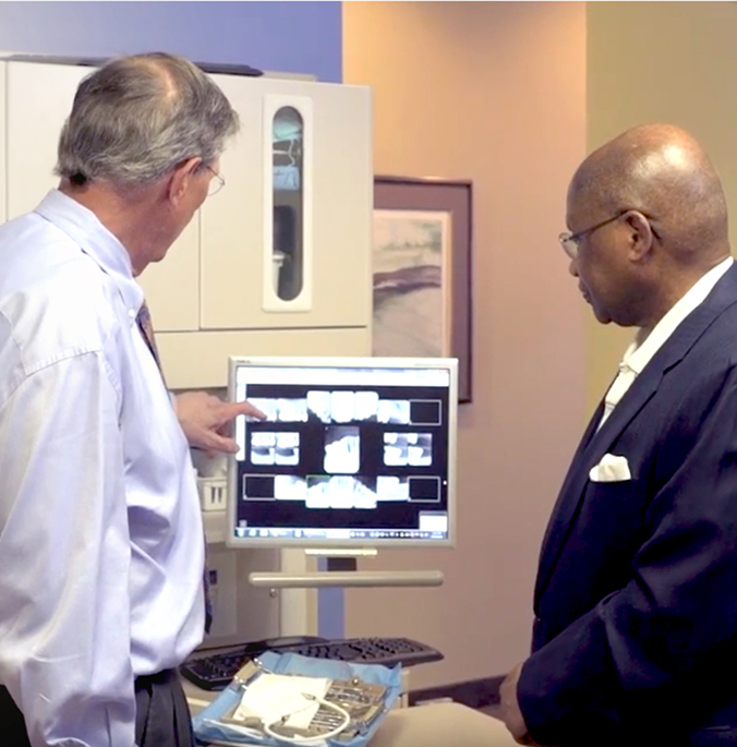 Dr. Withers using software to educate a patient